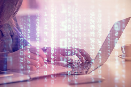 Multi exposure of woman hands working on computer and data theme hologram drawing. Tech concept.の写真素材