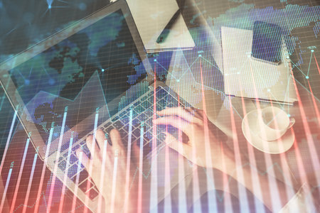 Double exposure of woman hands typing on computer and forex chart hologram drawing. Stock market invest concept.の写真素材