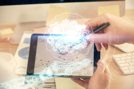 Multi exposure of man's hands holding and using a digital device and data theme drawing. Innovation concept.の写真素材