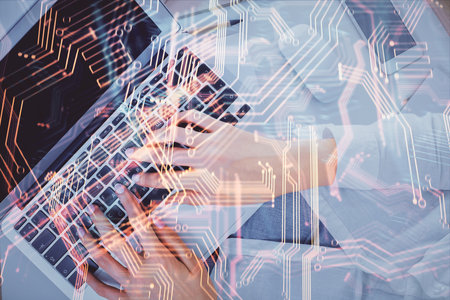 Double exposure of woman hands working on computer and tech theme hologram drawing. Top View. Technology concept.の写真素材