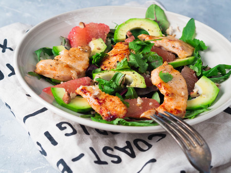 Salad with grapefruit, chicken, avocado and various kinds of lettuce leavesの写真素材