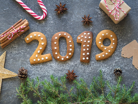 Ginger Christmas or New Year cookies in the form of numbers 2019 on a dark background .Seasonal packaging and New Year's attributes.の写真素材