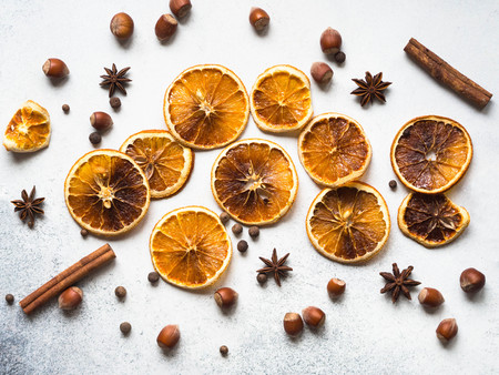 Bright Christmas or New Year  - dry orange slices and spices. Ingredients for making winter seasonal drink - mulled wine.の写真素材