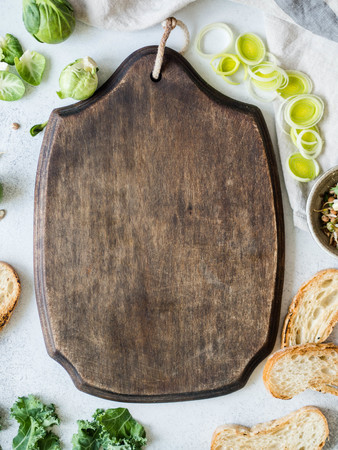 Raw vegetarian ingredients for cooking, germinated seeds and bread slices on table and Blackboard in the middle for recipe recording. top viewの写真素材