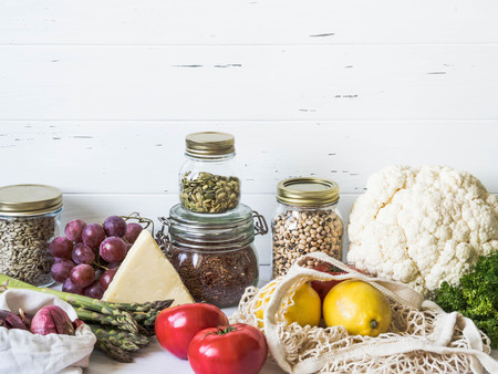 Various fresh food - vegetables and fruits in eco-friendly package on white marbleの写真素材