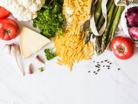 Various Italian fresh food in eco-friendly package on white marbleの写真素材