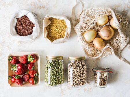 Various fresh food in eco-friendly package on whiteの写真素材