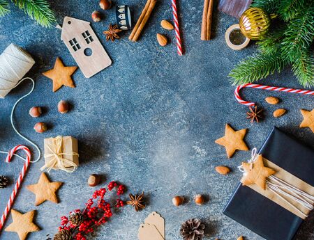 Christmas Fir branches, spices and Christmas attributes on a white woodenの写真素材