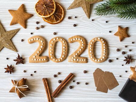 Ginger biscuits of the form of numbers and 2020 new year ginger cookies white woodの写真素材