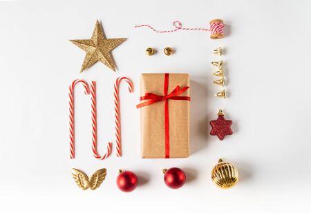 Christmas flat lay composition red and gold color. Christmas decor on a white background top viewの写真素材