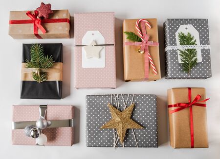 Various Christmas gift boxes. Collection of Christmas or new year gift boxes and decoration on white background. Gift Wrapping Decor Ideas. Flat lay. Copy spaceの写真素材