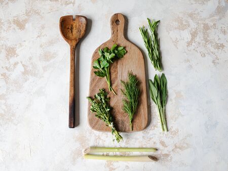 Fresh raw Herbs and wood kitchen were frame on textured background. top viewの写真素材