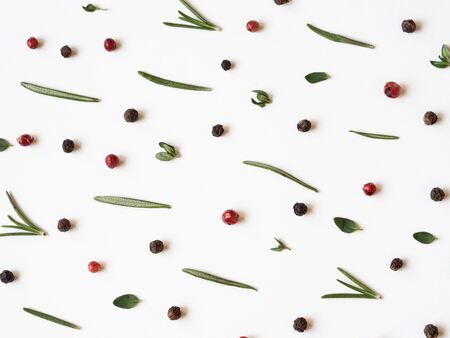 Creative decorative food composition of various spices and fresh herbs on white background. Top view.の写真素材