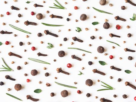 Creative decorative food composition of various spices and fresh herbs on white background. Top view.の写真素材