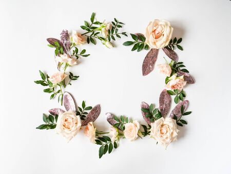 Frame colorful various flowers and leaves on a white background. Top viewの写真素材