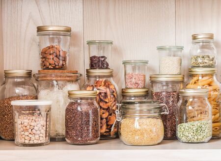 Shelf in the kitchen with various cereals and seedsの写真素材