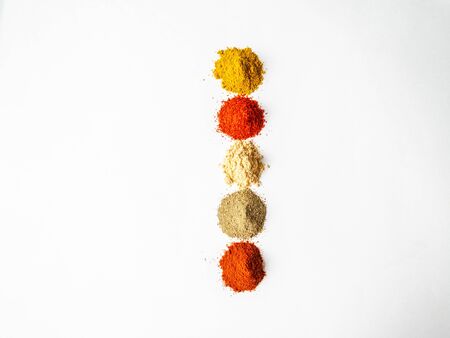 Various dry spices pile on a whiteの写真素材