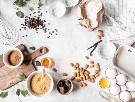 Cooking flat lay frame of various food ingredients for baking on whiteの写真素材