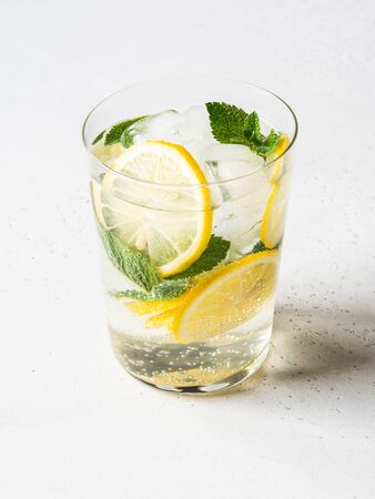 Homemade Summer citrus lemonade with ice in glass on a white background.の写真素材