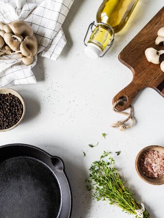 A set of products and kitchen utensils for cooking fried oyster mushrooms with thyme. Top viewの写真素材