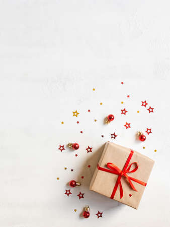 Christmas or new year gift and festive decor on texture white background. Top view, flat lay. Copy spaceの写真素材