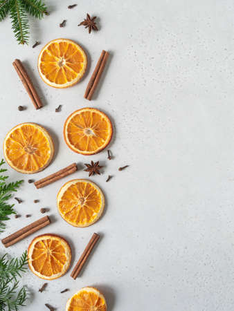 Bright Christmas or New Year background - dry orange slices and spices. Ingredients for making winter seasonal drink - mulled wine. Top viewの写真素材
