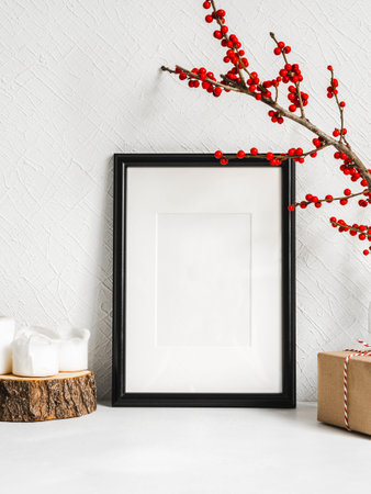 Style Christmas decor and black blank frame. Mock up for Christmas design. Copy space. Front viewの写真素材