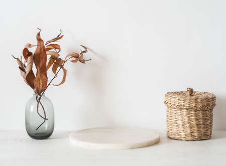 White marble round podium on white background, platform for product display and decoration. Blank for mockup design. Front view. Copy spaceの写真素材