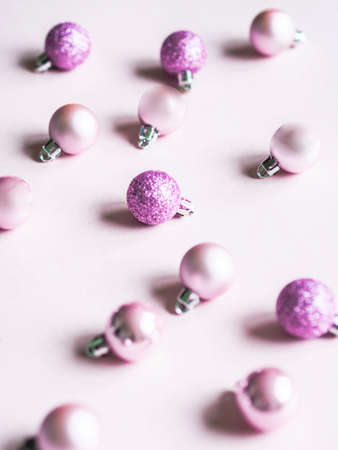 Christmas composition. Pink background and pink different Christmas ball. Copy spaceの写真素材