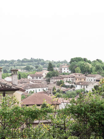 View of the rooftops of a beautiful Italian city with narrow streets and streets and old roofs. Front view from aboveの写真素材
