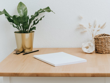 Home office wood desk with home decor amd various accessories. front view. copy spaceの写真素材
