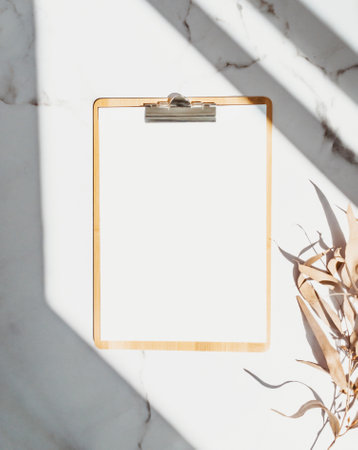 Clipboard with blank paper with copy space on white background with shadows. minimal concept. Menu board, business template. top viewの写真素材