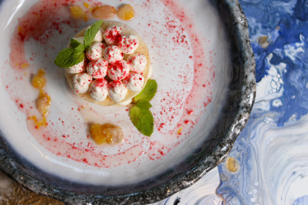 Desert with cream, chips and strawberryの写真素材