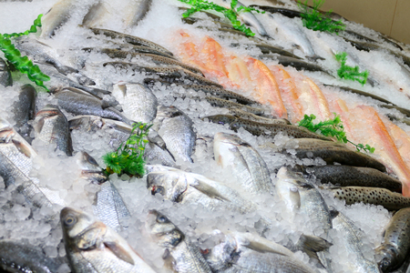 Fresh fish on ice in the marketの写真素材