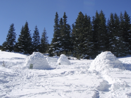 Snow igloos in a winter mountainの写真素材