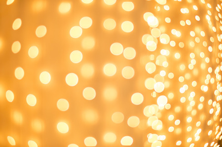 Defocused Christmas lights decoration in golden color.の写真素材