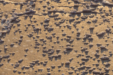 Beautiful texture created by the salt crystals form in the process of natural evaporation of sea water.の写真素材
