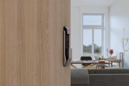 Digital Door handle or Electronics knob  for access to room security, Door wooden half opening through interior living room background, selective focusの写真素材