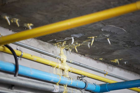 PU Foam injections for fixed water leakage under concrete floor or ceiling. Selective focus.