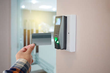 Hotel door security Unlocking by application on mobile phone. Digital door lock, key less system of access door. Close up and selective focus.の写真素材