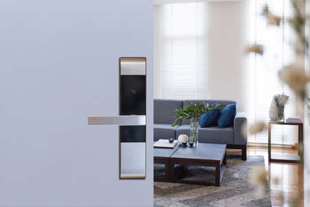 Hotel door security Unlocking by application on mobile phone. Digital door lock, key less system of access door. Close up and selective focus.の写真素材