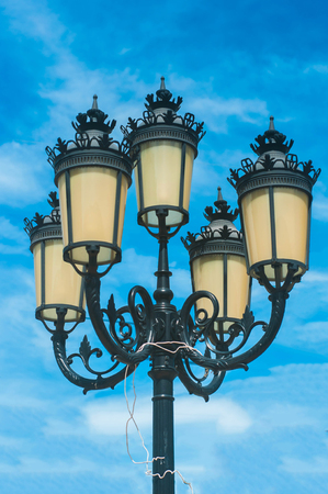 Vintage lamp with blue sky background.の写真素材