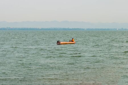 Fishing boat floating on the water.の写真素材