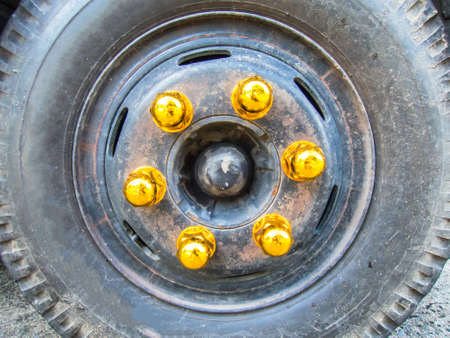 Bolts orange wheel hub of truck wheelの写真素材