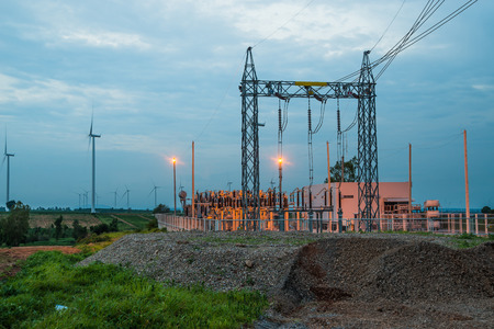 Wind turbines generate electricity at field all agriculture plantation in thailandの写真素材