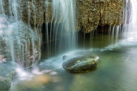waterfall in kanchanaburi in thailandの写真素材