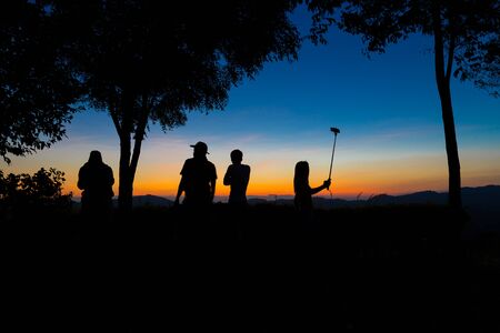 The silhouette people standing.Silhouette view on sunrise.Silhouette woman and men.