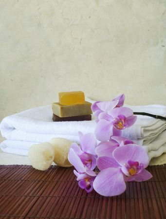  handmade paper with loofah sponge and handmade soap with orchid flowers for holiday or spaの写真素材