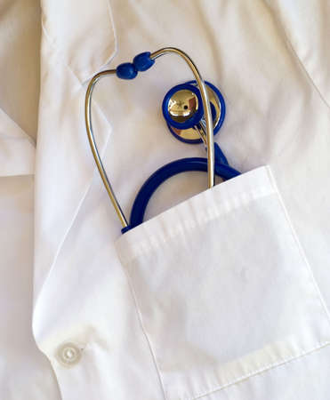stethoscope in doctors lab coat pocketの写真素材