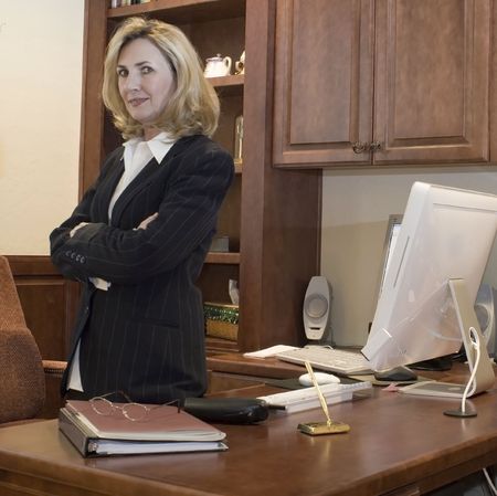 female business executive is in her officeの写真素材